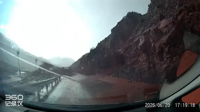 Video thumbnail for China: Chinese driver narrowly escapes mudslide after clearing rocks on mountain road.