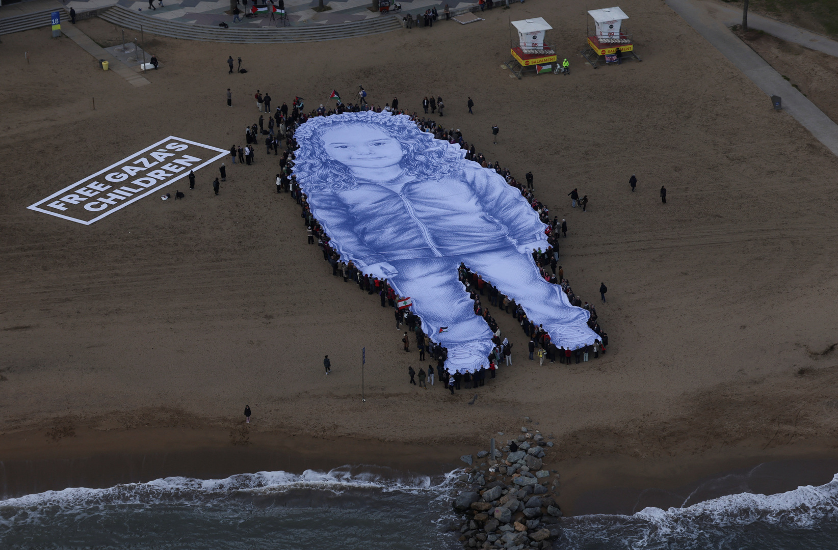 Video thumbnail for Giant Hind Rajab portrait unveiled in Spain for anniversary of her killing