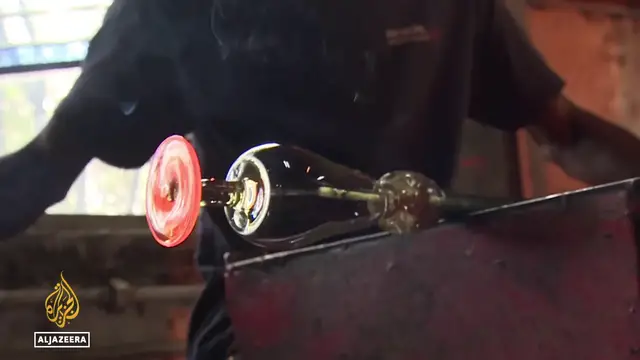 'Video thumbnail for Glass recycling in Kenya: Artisans turn glass waste into works of art'