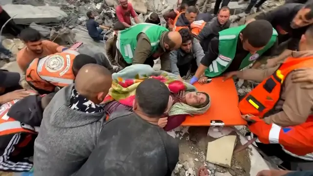 Video thumbnail for Pregnant woman pulled from rubble after Israeli attack on north Gaza