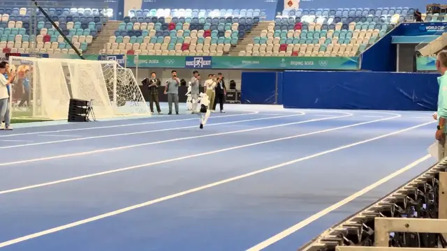 Video thumbnail for China: Humanoid robot charges forward with head down in China.