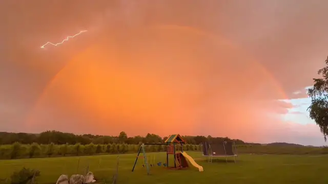 Video thumbnail for Lightning Strike Through a Rainbow at Sunset