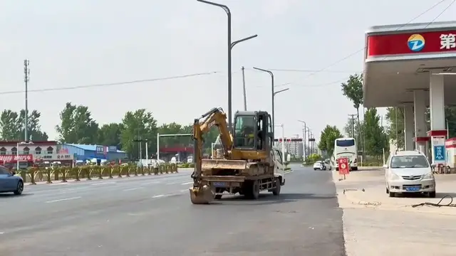 Video thumbnail for China: Excavator in China moves by pushing ground with mechanical arm.