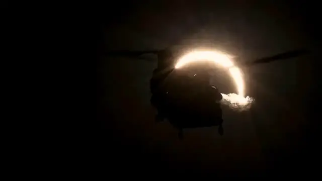 Video thumbnail for UK: Solar Eclipse Turns UK Sky Dark As Military Helicopter Takes Flight.