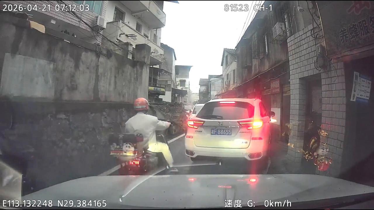 Video thumbnail for China: Chinese delivery rider narrowly escaped after car suddenly sped out of blind alley corner.