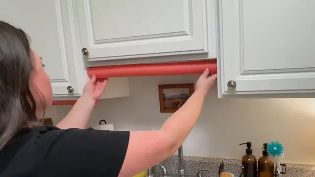 'Video thumbnail for Stick a pool noodle under your kitchen cabinet - this is BRILLIANT!'