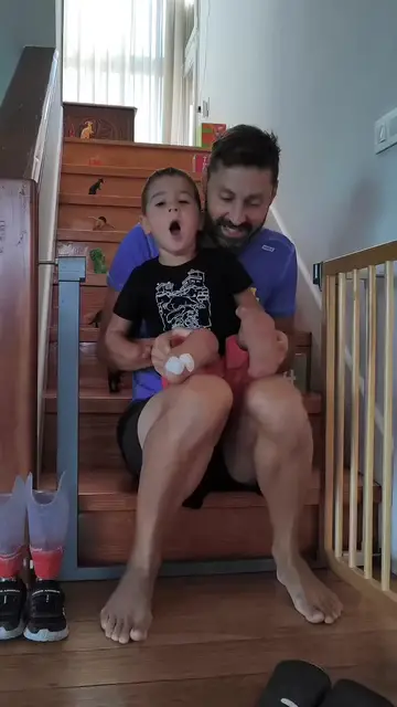 Video thumbnail for Little Boy with Prosthetic Legs Conquers the Stairs with Dad