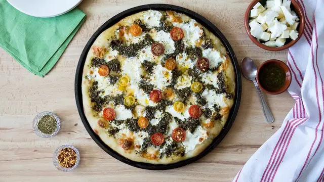 'Video thumbnail for Argentine-Inspired Chimichurri And Tomato Pizza Recipe'