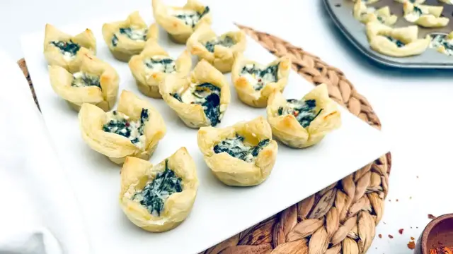 'Video thumbnail for Handheld Spinach And Feta Tarts Recipe'