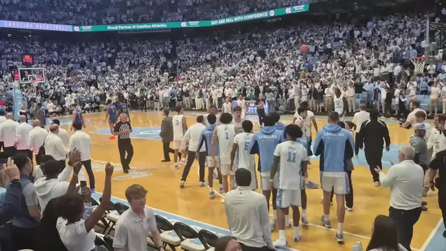 'Video thumbnail for The final seconds of #UNC's win from courtside, including Davis greeting Roy Williams after the game'