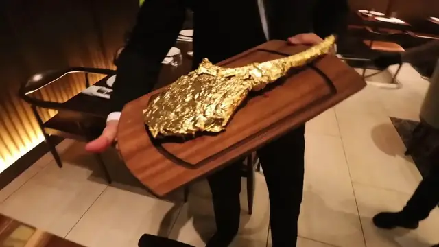 'Video thumbnail for Eating A $10,000 Golden Steak (24k Gold)'