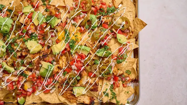 'Video thumbnail for These Cheesy Chicken Nachos Have A Chili-Lime Twist'