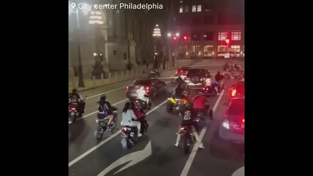 'Video thumbnail for Motorcyclist shatters rear windshield during street takeover while armed with two kids inside'