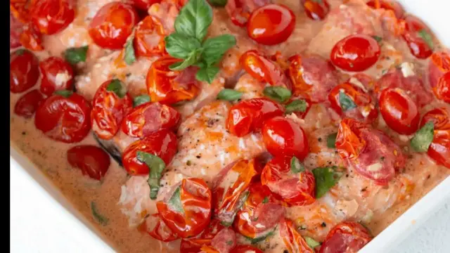 'Video thumbnail for 1-Pan Baked Salmon With Burst Tomatoes Recipe'