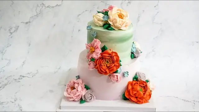 'Video thumbnail for Beautiful flowers on 2 tier birthday cake decoration for love | Délicieux Pie | Shot on iPhone'