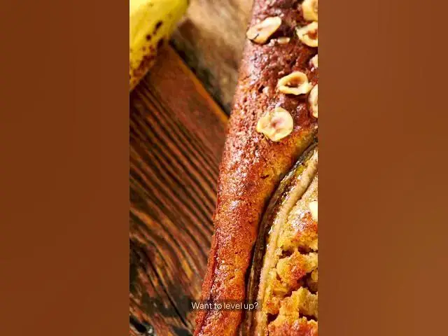 'Video thumbnail for 🍌 Irresistible Banana Bread Bliss: A Slice of Heaven! 🍞✨'