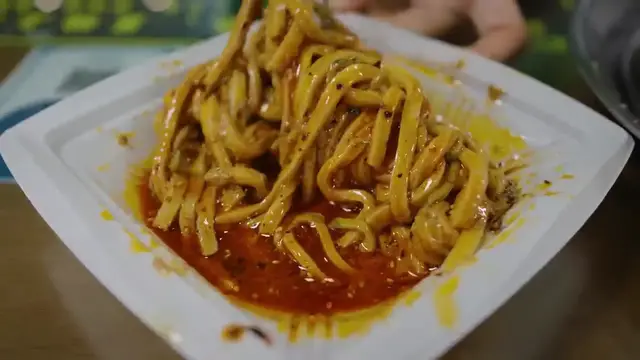 'Video thumbnail for Chinese Food Battle__ 2 Must-Try Liangpi Noodles in Xi_an_(720P_HD)'