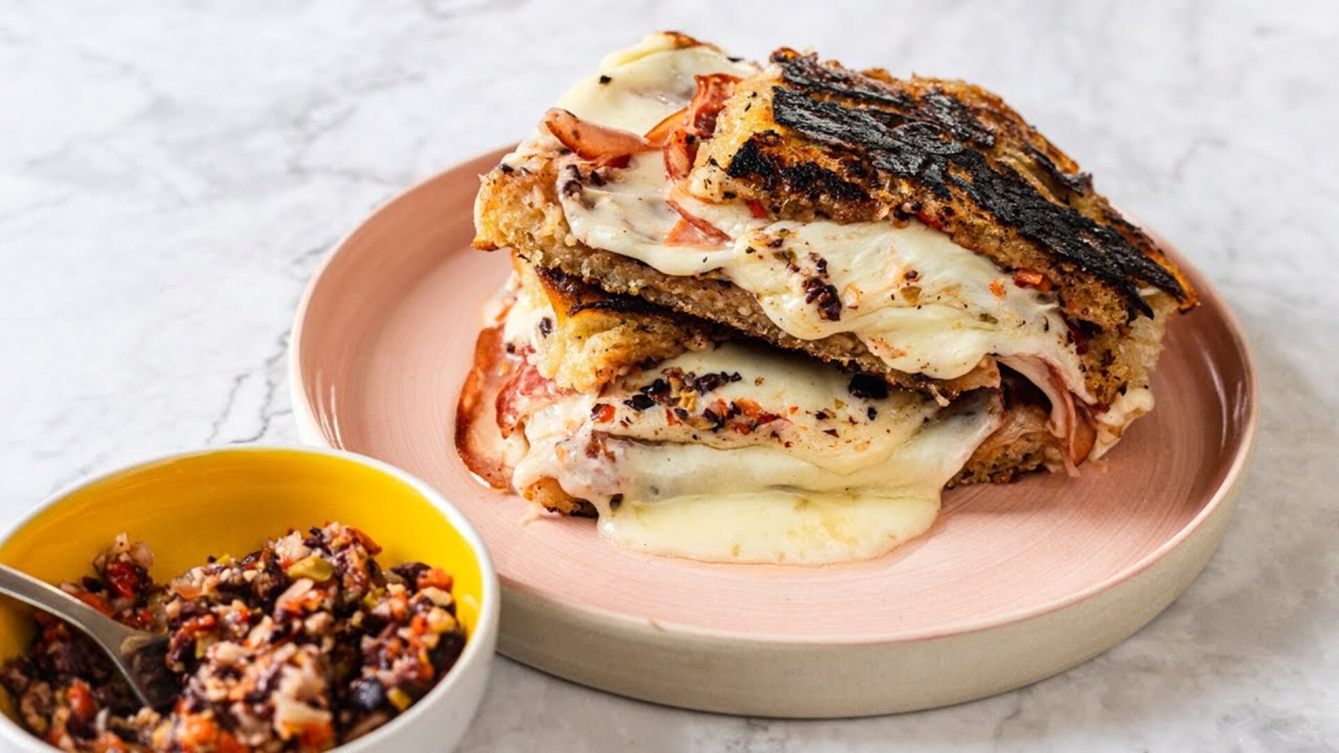 Video thumbnail for Loaded Muffuletta Grilled Cheese Recipe