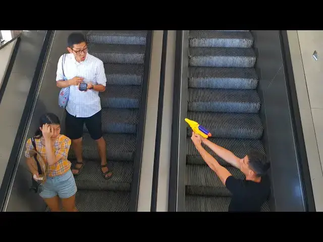 Video thumbnail for SHOOTING STRANGERS ON ESCALATOR