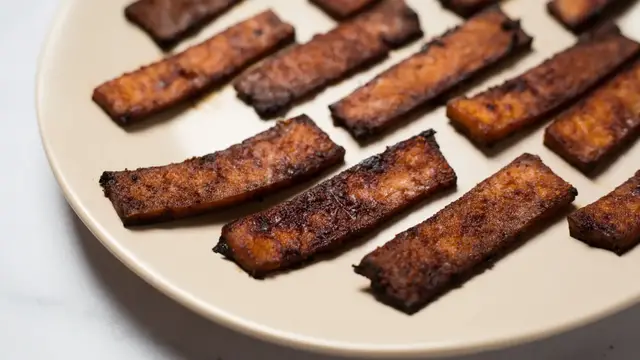 Video thumbnail for Crispy, Smoky Vegan Tofu Bacon That'll Impress Even Meat Lovers