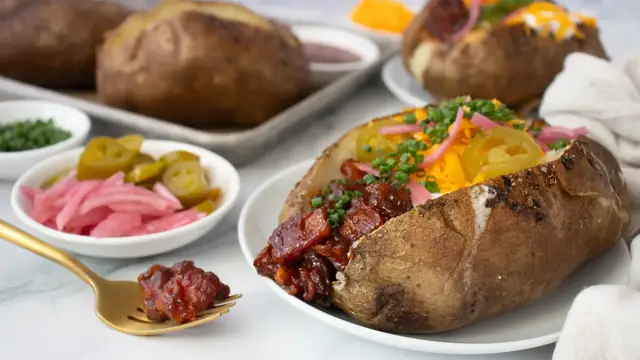 Video thumbnail for Loaded BBQ Pork Belly Baked Potatoes Recipe
