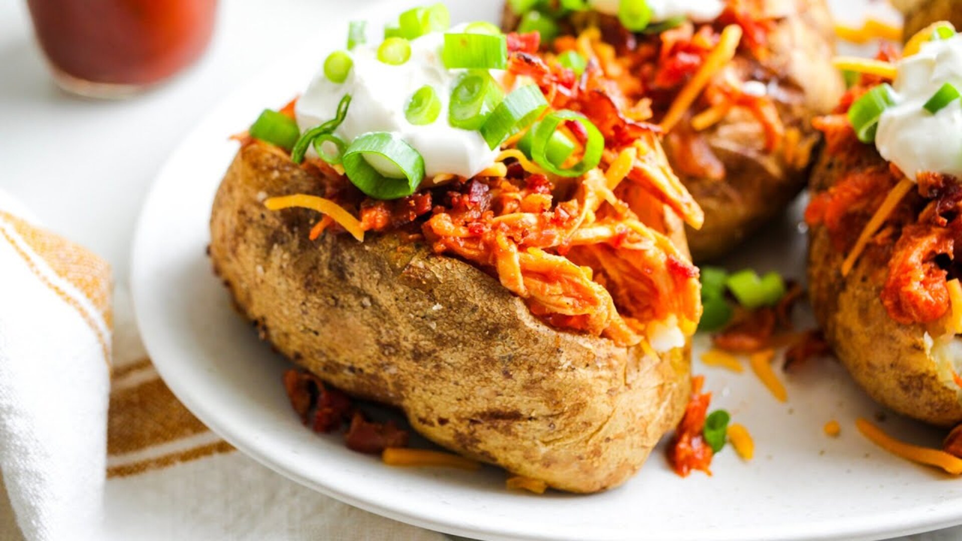 Video thumbnail for Loaded BBQ Chicken Baked Potatoes Recipe